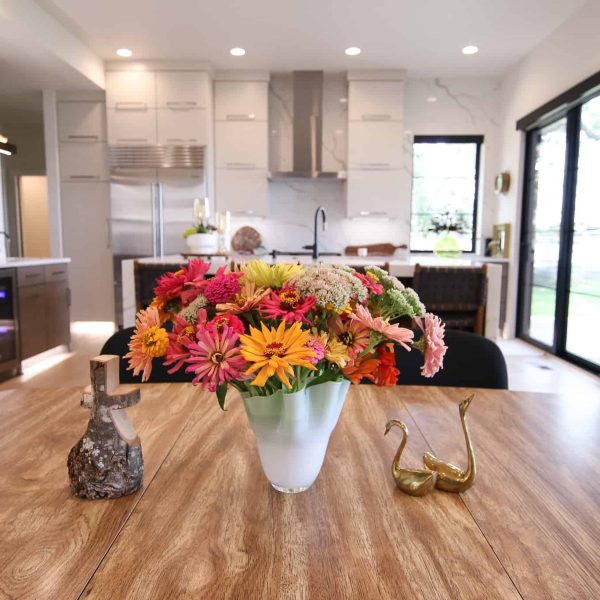 Newman Home on Lake Eunice, MN • Dining Room table vase with colorful flowers