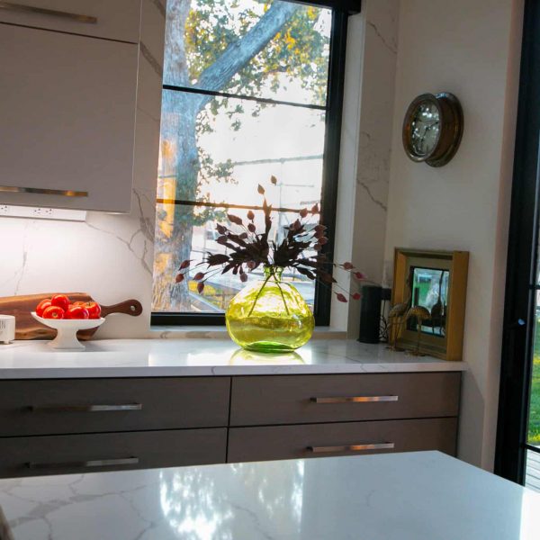 Newman Home on Lake Eunice, MN • green clear glass vase with flowers on kitchen counter • evening video