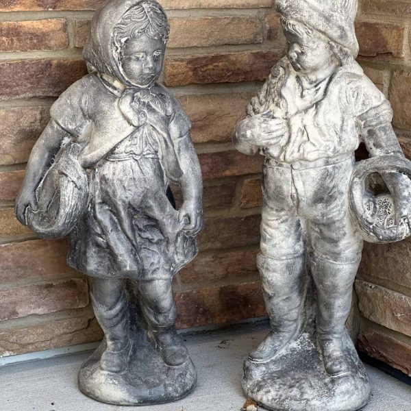 Schaefbauer home on Munson Lake roadside exterior statues near entry door