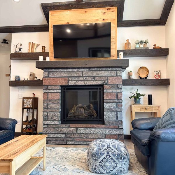 Schaefbauer home on Munson Lake living room fireplace with stained mantel and open shelves