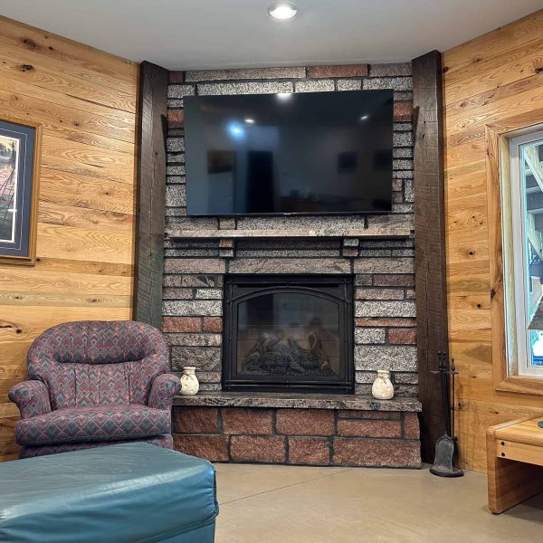 Schaefbauer home on Munson Lake walkout basement corner block fireplace and TV viewing area