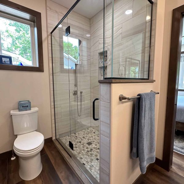 Bossert Home on Lake Lida • Master Bathroom shower and toilet area