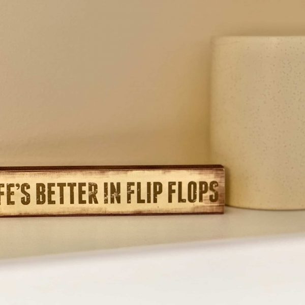 Bossert Home on Lake Lida • Life's Better in Flip Flops sign on the closet shelf