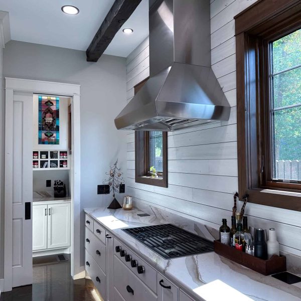 Spicer Home on Pelican Lake kitchen hood with food prep and cooking area (pantry in the background)