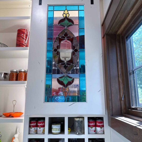 Spicer Home on Pelican Lake • stained glass doors on pantry shelves