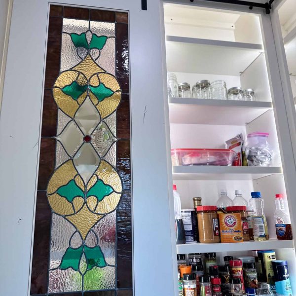 Spicer Home on Pelican Lake • stained glass doors on pantry shelves