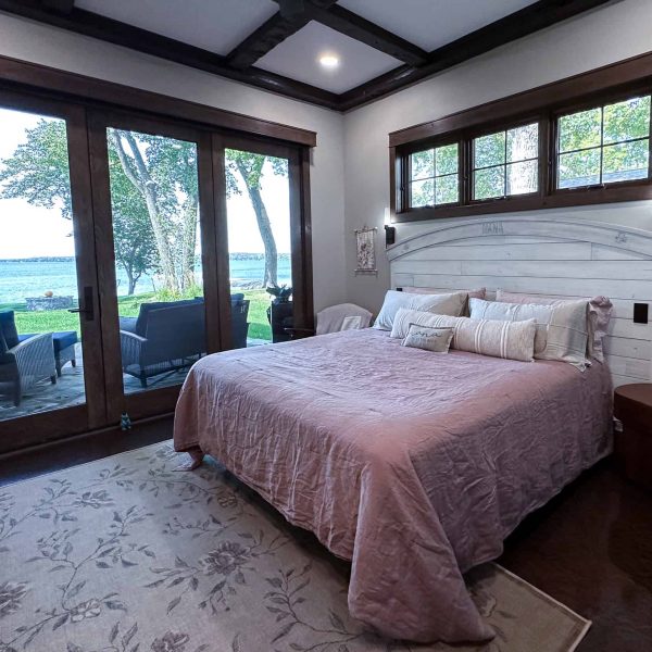 Spicer Home on Pelican Lake • Feminine Master Bedroom with patio windows in the background