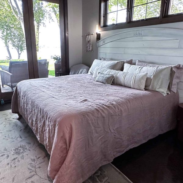 Spicer Home on Pelican Lake • Feminine Master Bedroom with patio windows in the background