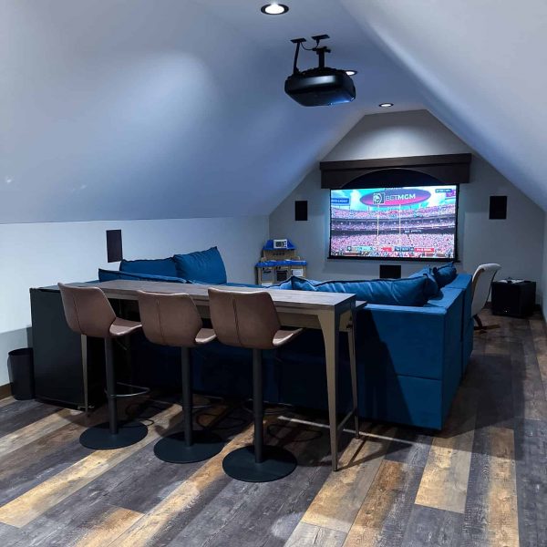 Spicer Home on Pelican Lake • TV theater room with a large sectional couch and high table seating area