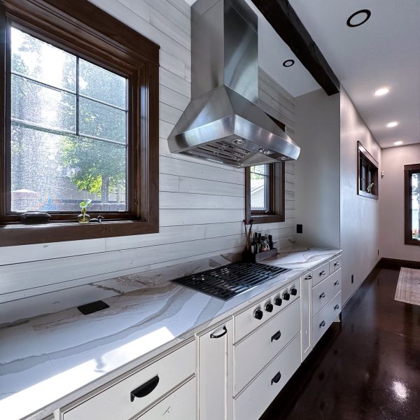 Spicer Home on Pelican Lake kitchen hood with food prep and cooking area