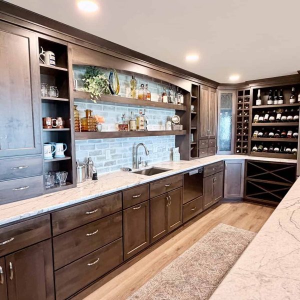 Contemporary kitchen with dark wood cabinets, open shelving, and stainless steel appliances.
