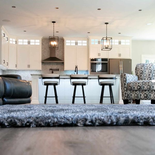 Dagenais Custom Built Home ∙ Basement Stairway View of Living Room & Kitchen